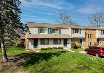 a home with a red car parked in front of it at Forest Glen, Michigan, 48642